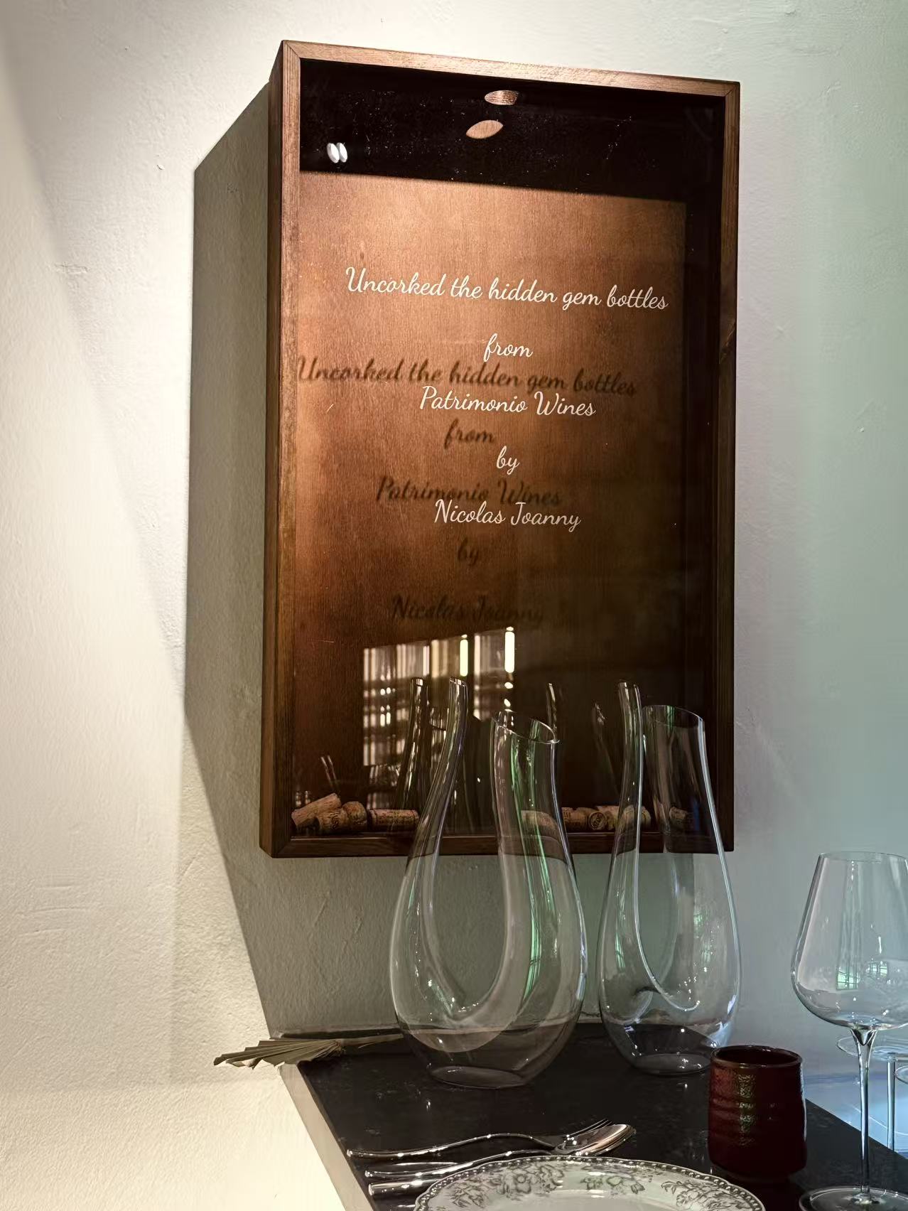 Glassware and a Patrimonio display inside the wine bar