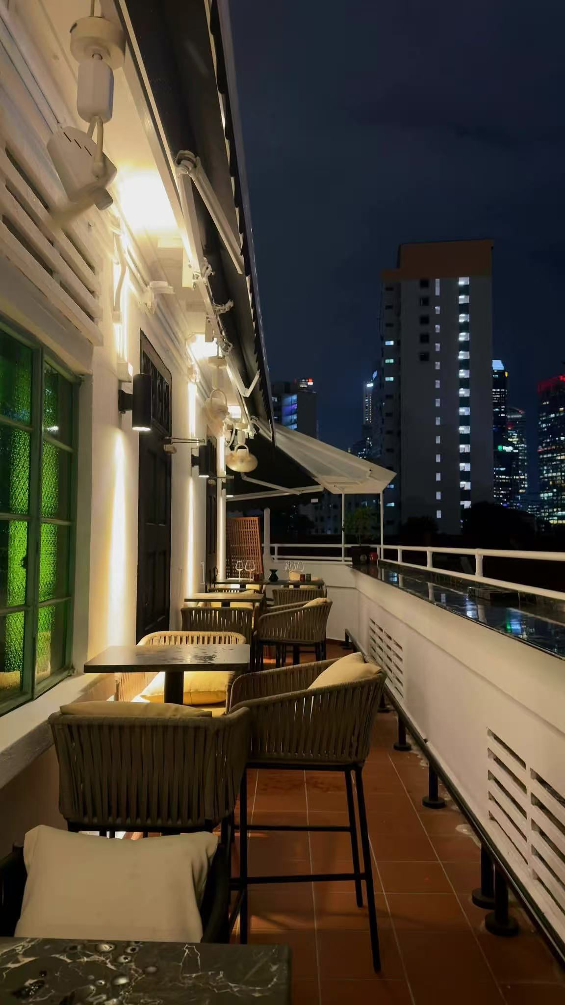 Patrimonio's terrace overlooking Singapore at night